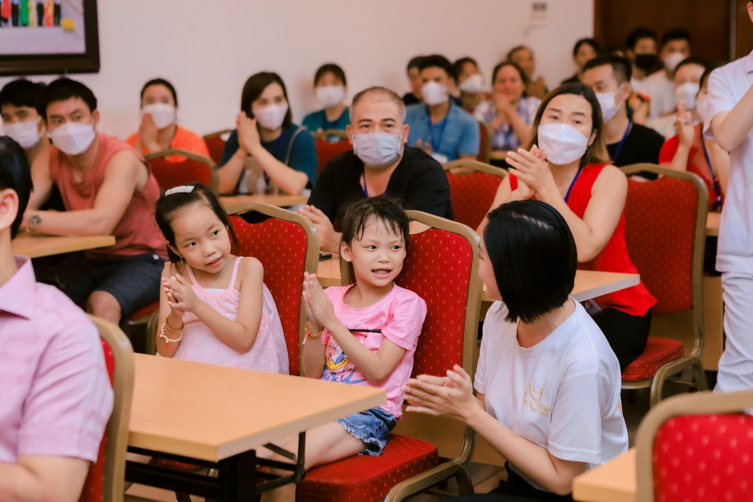 A group of people in a classroom wearing face masks

Description automatically generated with medium confidence